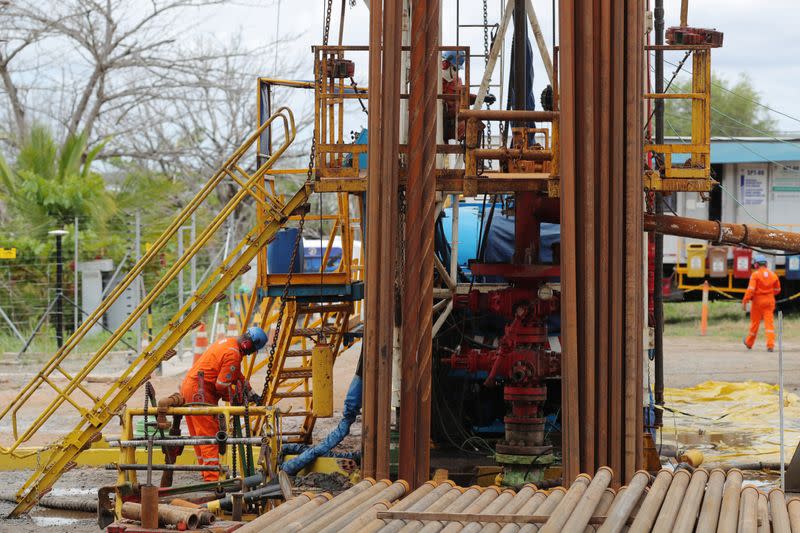 Workers labor at a facility of the petrochemical company Braskem in Maceio