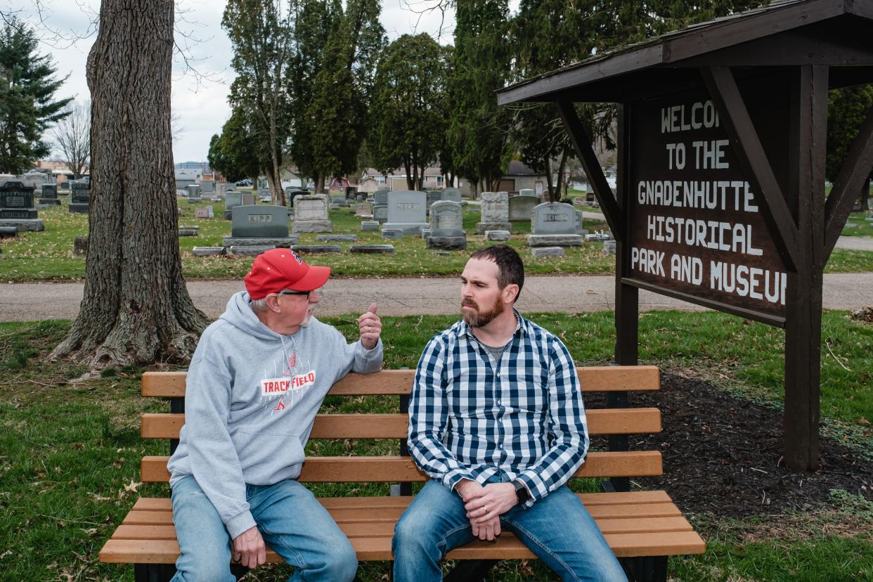 John Heil, left, retiring curator of the Gnadenhutten Museum, chats with incoming curator, Andy McMillen.