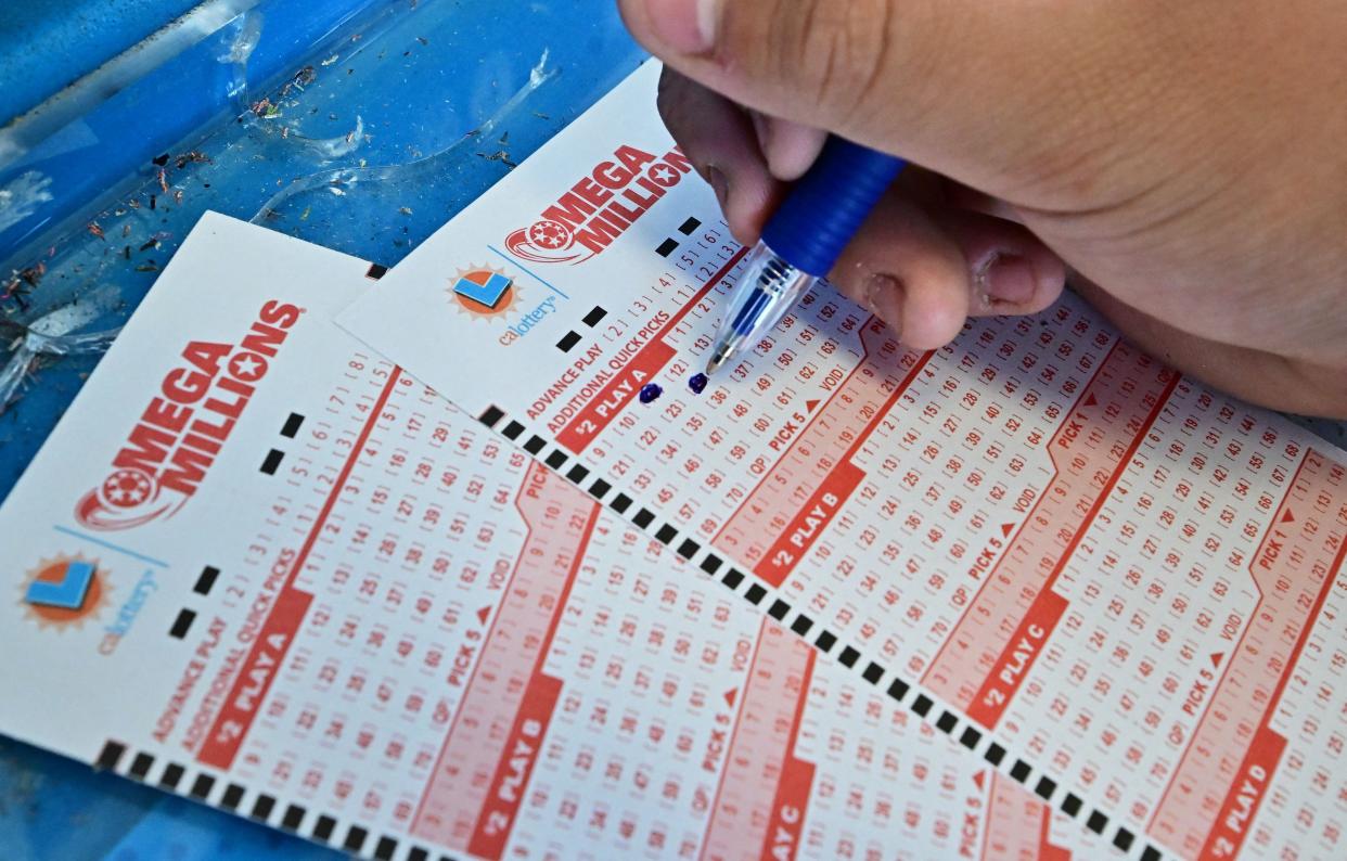 Numbers on tickets for the Mega Millions lottery are selected by a purchaser in Los Angeles, California, in 2023.