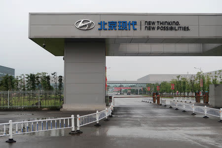 A Beijing Hyundai sign is seen at an entrance to the Beijing Hyundai Motor plant in Chongqing, China October 8, 2018. Picture taken October 8, 2018. REUTERS/Yilei Sun