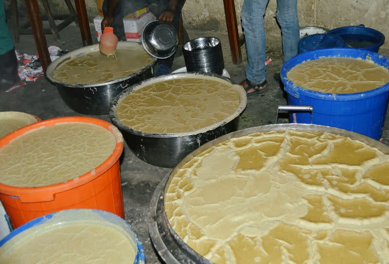 Porridge is seen filled in troughs inside a prison in the northeast of Bunia
