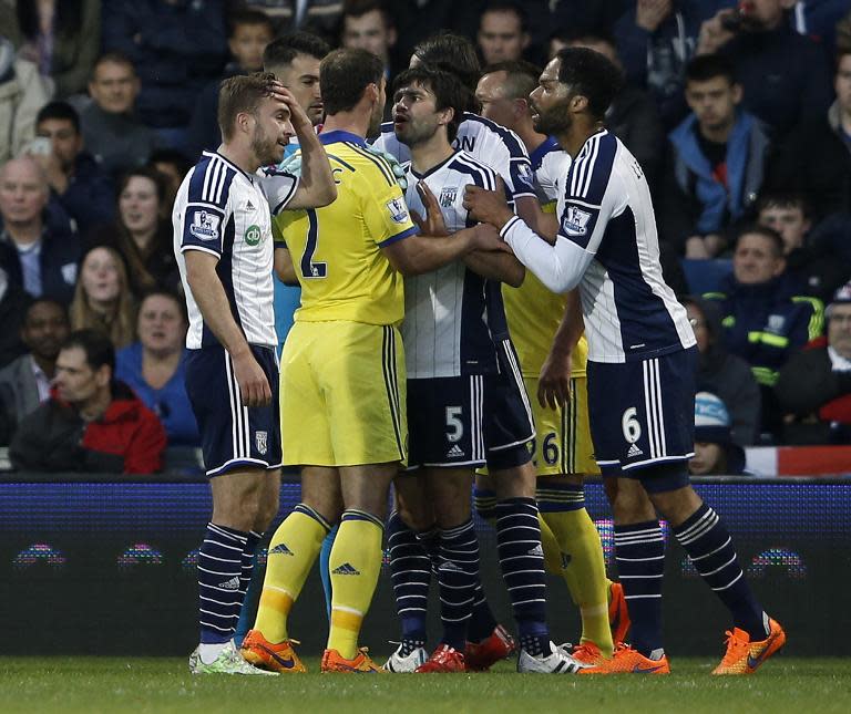 Chelsea defender Branislav Ivanovic (3L) argues with West Bromwich Albion midfielder Claudio Yacob (C) after Cesc Fabregas (unseen) was given a red card