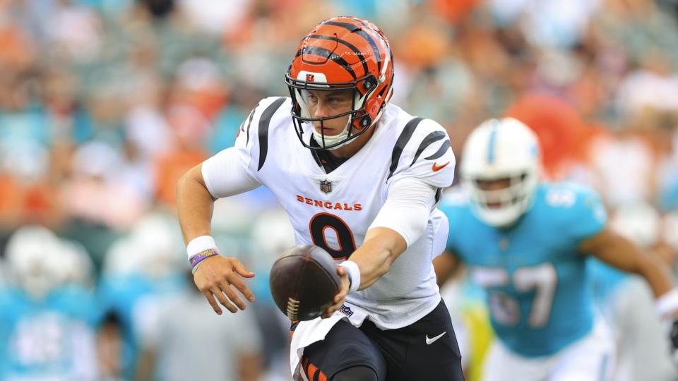 Cincinnati Bengals quarterback Joe Burrow looks to handoff during an preseason game on Aug. 29.