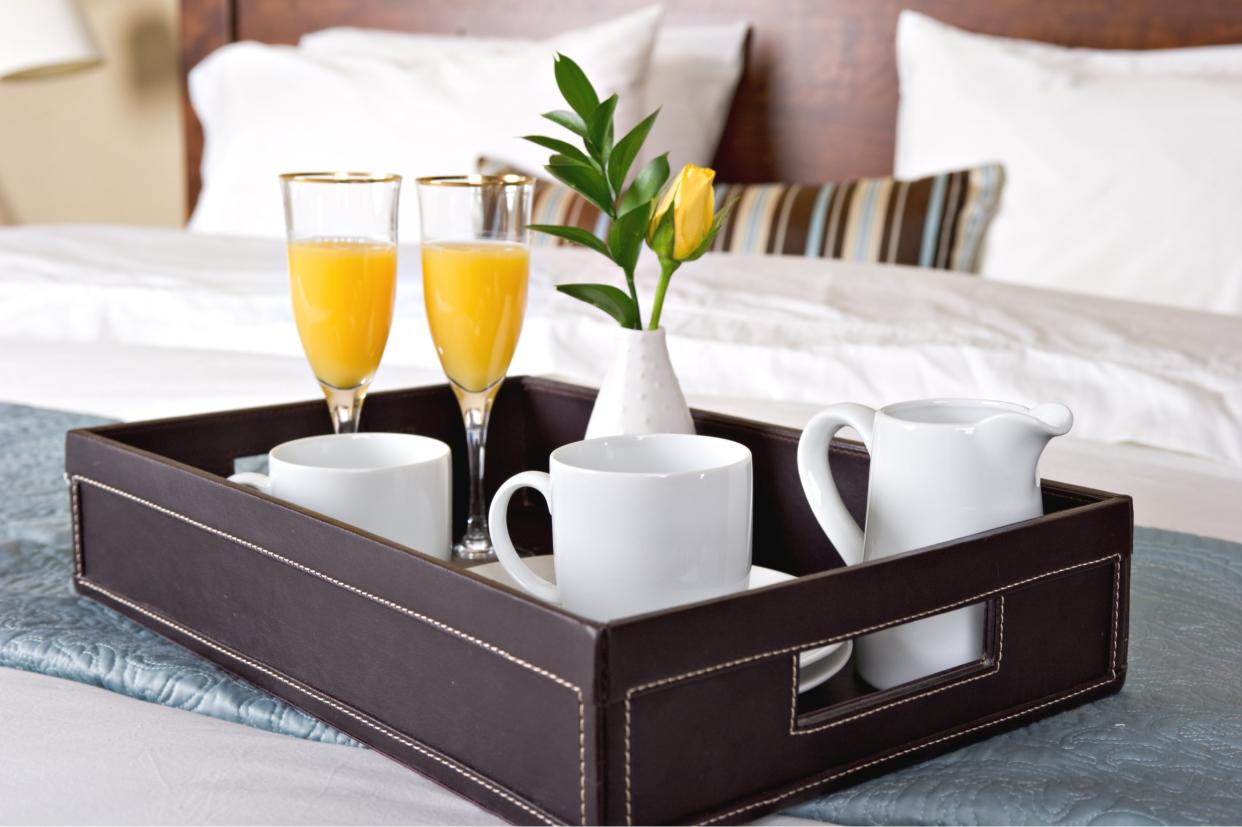 breakfast tray on a hotel bed