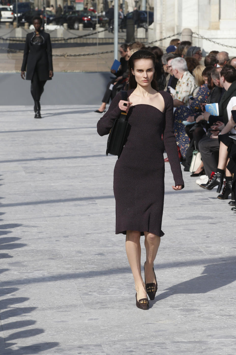 A model wears a creation as part of the Bottega Veneta women's Fall-Winter 2019-2020 collection, that was presented in Milan, Italy, Thursday, Friday, Feb. 22, 2019. (AP Photo/Antonio Calanni)