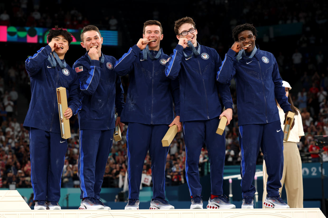 PARIS, FRANCE - JULY 29: (L-R) Bronze medalists Asher Hong, Paul Juda, Brody Malone, Stephen Nedoroscik and Frederick Richard of Team United States pose with their medals on the podium during the medal ceremony for the Artistic Gymnastics Men's Team Final on day three of the Olympic Games Paris 2024 at Bercy Arena on July 29, 2024 in Paris, France. (Photo by Jamie Squire/Getty Images)