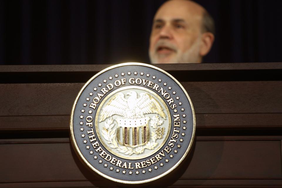 U.S. Federal Reserve Chairman Ben Bernanke responds to reporters during his final planned news conference before his retirement, at the Federal Reserve Bank headquarters in Washington, December 18, 2013. The U.S. Federal Reserve announced plans to trim its aggressive bond-buying program on Wednesday but sought to temper the long-awaited move by suggesting its key interest rate would stay lower for even longer than previously promised. REUTERS/Jonathan Ernst (UNITED STATES - Tags: POLITICS BUSINESS LOGO)