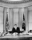 <p>Lyndon B. Johnson sits at the Oval Office desk, posing for one of his first official photographs following the death of his predecessor, John F. Kennedy.</p>