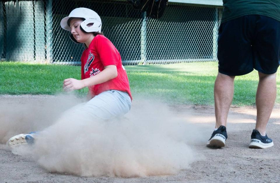 Liam Musante slides into home base during a drill on Monday, July 29, 2024, at Dooley Field in Sacramento. “My favorite thing about playing on this team is playing with friends and getting to hang out,” Musante said.