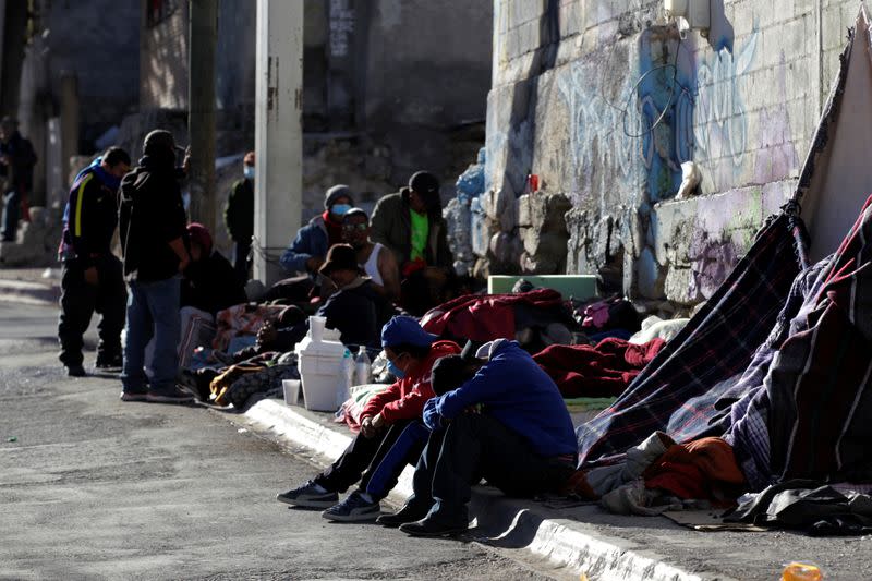 Migrants rest in an improvised shelter set up outside the Posada Belen migrant shelter, which is closed due to an outbreak of the coronavirus disease COVID-19, in Saltillo