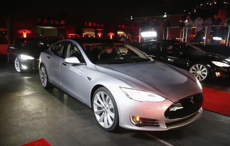 New all-wheel-drive versions of the Tesla Model S car are lined up for test drives in Hawthorne, California October 9, 2014. REUTERS/Lucy Nicholson