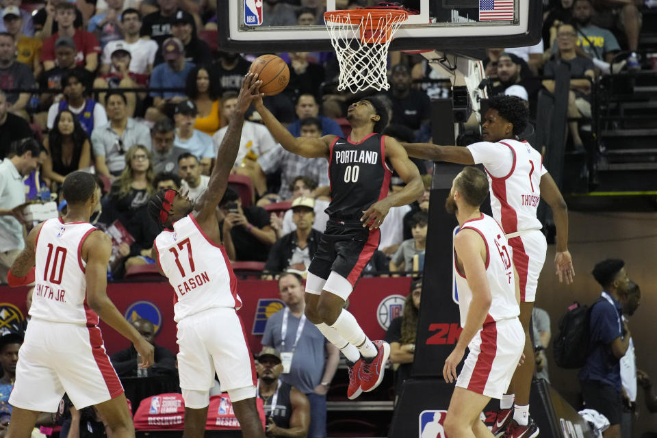 Portland Trail Blazers' Scoot Henderson shoots over Houston Rockets' Tari Eason during the first half of an NBA summer league basketball game Friday, July 7, 2023, in Las Vegas. (AP Photo/John Locher)