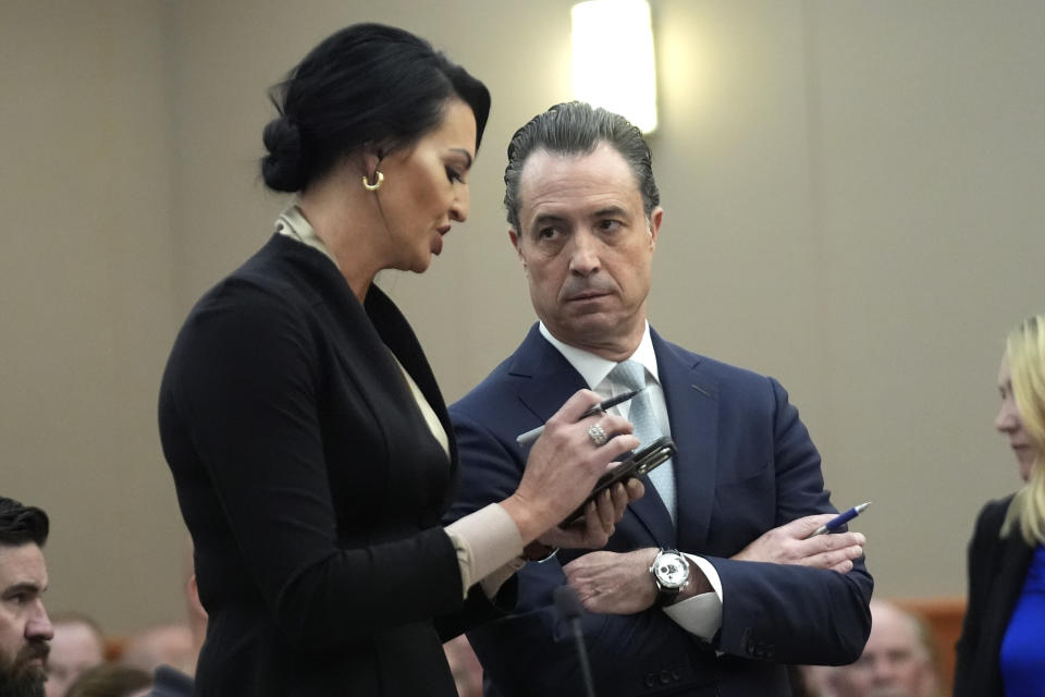 Defense attorney Skye Lazaro, left, talks to Summit County Chief Prosecutor Brad Bloodworth about delaying until June a preliminary hearing for Lazaro's client, Kouri Richins, during a hearing Wednesday, May 15, 2024, in Park City, Utah. Richins, a Utah mother of three, who wrote a children's book about coping with grief after her husband's death, was later accused of fatally poisoning him. (AP Photo/Rick Bowmer, Pool)