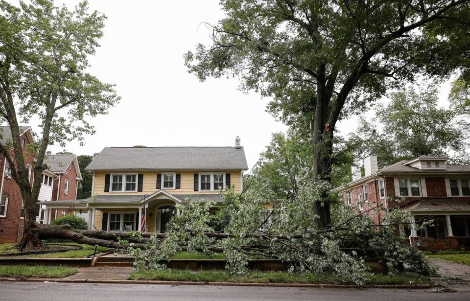A fallen tree lays across the yard of a home along the 900 block of South York Street in Gastonia, N.C., Thursday, May 9, 2024 after severe storms yesterday afternoon caused damage and power outages in the area. Melissa Melvin-Rodriguez/mrodriguez@charlotteobserver.com