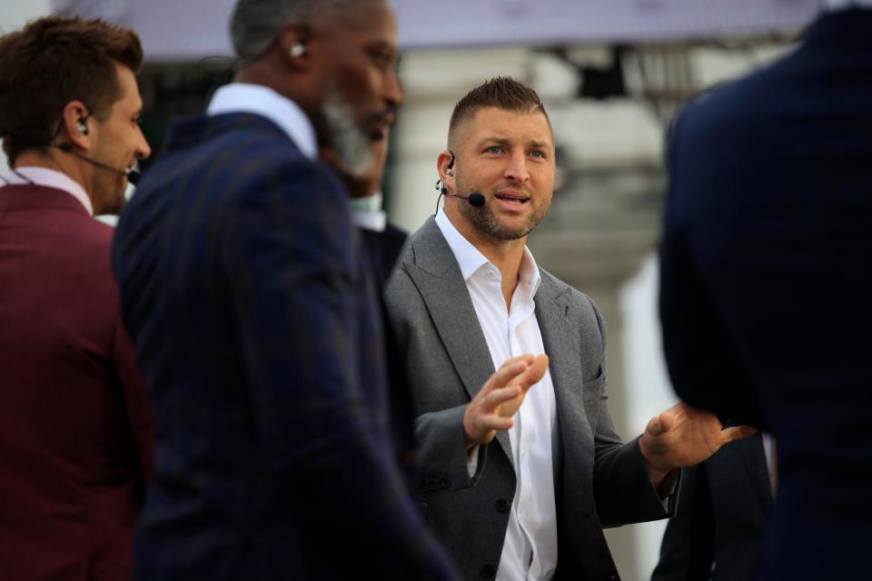 Florida Gators alumni Tim Tebow talks with on-air colleagues for the ESPN show SEC Nation before an NCAA football game between the Georgia Bulldogs and the Florida Gators Friday, Oct. 28, 2022 at TIAA Bank Field in Jacksonville. [Corey Perrine/Florida Times-Union]