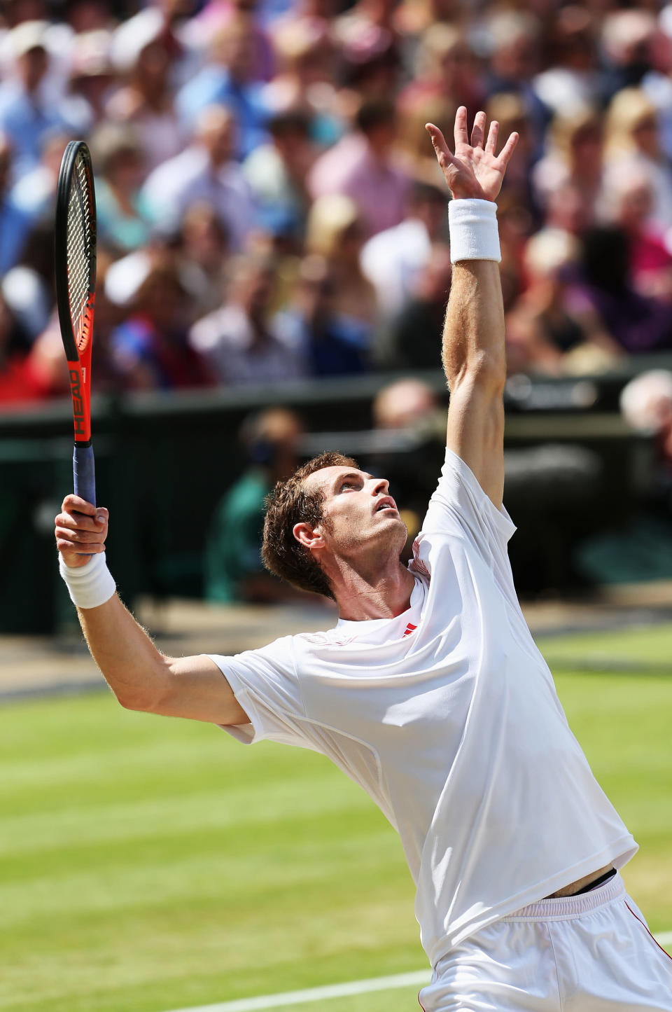 Andy Murray of Great Britain serves in his Gentlemen's Singles final match against Roger Federer at Wimbledon.