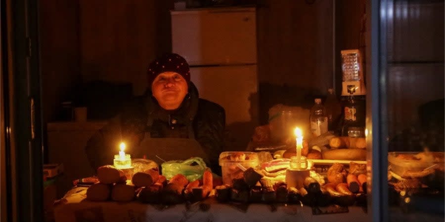 A saleswoman in Odessa during a power outage on December 5, 2022