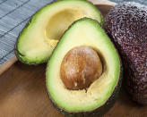 To ripen a hard avocado overnight, simply put it in a paper bag with a banana over night. The banana releases ethylene, a hormone that triggers the ripening process in fruit.