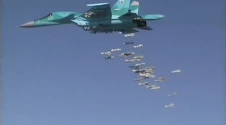 A still image, taken from video footage and released by Russia's Defence Ministry on August 18, 2016, shows a Russian Sukhoi Su-34 fighter-bomber based at Iran's Hamadan air base dropping off bombs in the Syrian province of Deir ez-Zor. Ministry of Defence of the Russian Federation/Handout via REUTERS TV