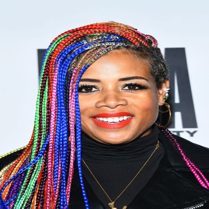 Close-up of Kelis in colorful braids