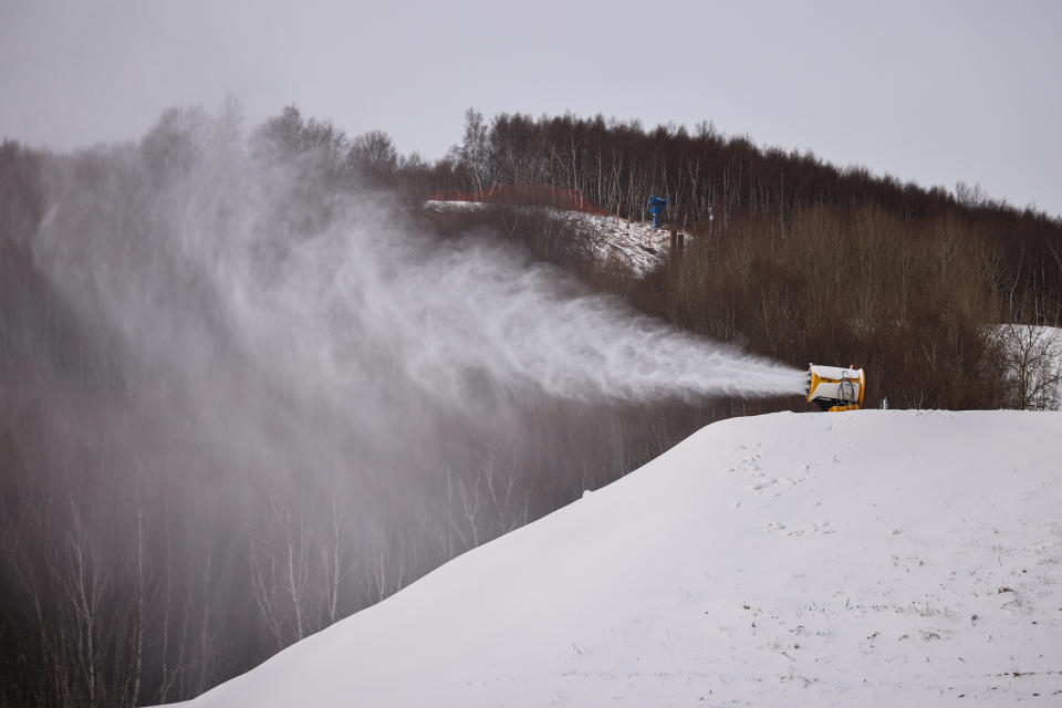A TechnoAlpin snow gun sprays snow onto a slope for recreational use at the Genting ski resort in Zhangjiakou near venues of the Beijing 2022 Winter Olympics, Hebei province, China, November 20, 2021. Picture taken November 20, 2021.  REUTERS/Thomas Peter