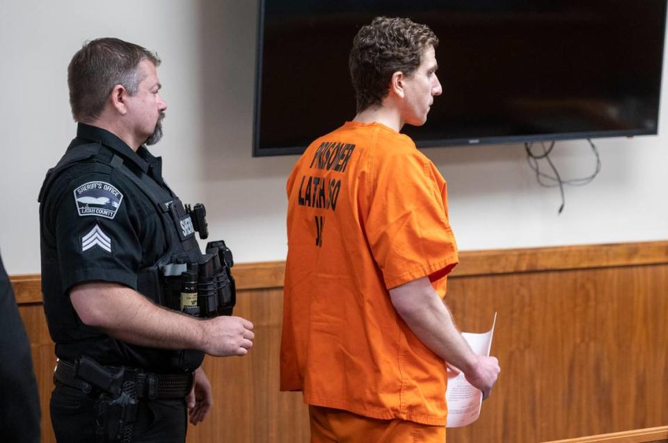 Bryan Kohberger is escorted out of the courtroom following his arraignment hearing Monday in District Court in Latah County.