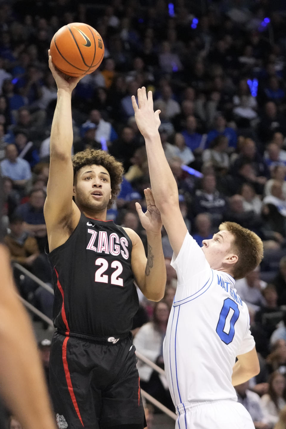 Gonzaga forward Anton Watson (22) shoots against BYU forward Noah Waterman (0) during the first half of an NCAA college basketball game Thursday, Jan. 12, 2023, in Provo, Utah. (AP Photo/Rick Bowmer)