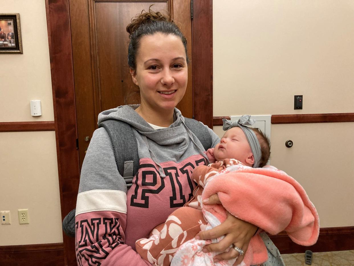 Patience Ruiz urged Pueblo City Council to pass a sales tax exemption on diapers and menstrual products at their meeting Tuesday. She held her 2-month-old daughter, Rainey Ruiz, while she spoke.