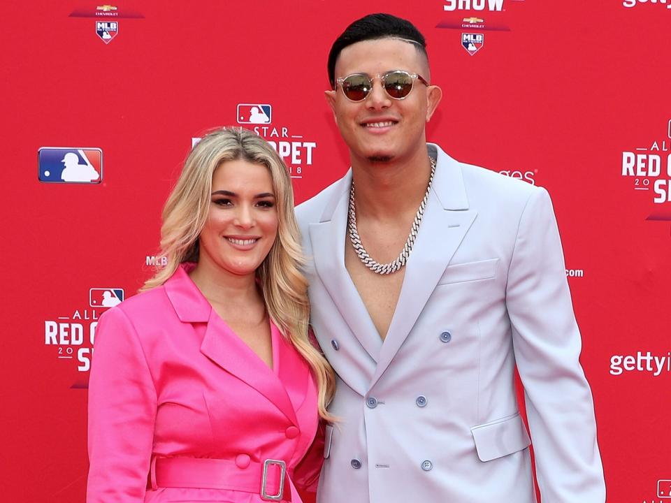 Manny Machado #13 of the Baltimore Orioles and the American League attends the 89th MLB All-Star Game, presented by MasterCard red carpet with wife Yainee Alonso at Nationals Park on July 17, 2018 in Washington, DC