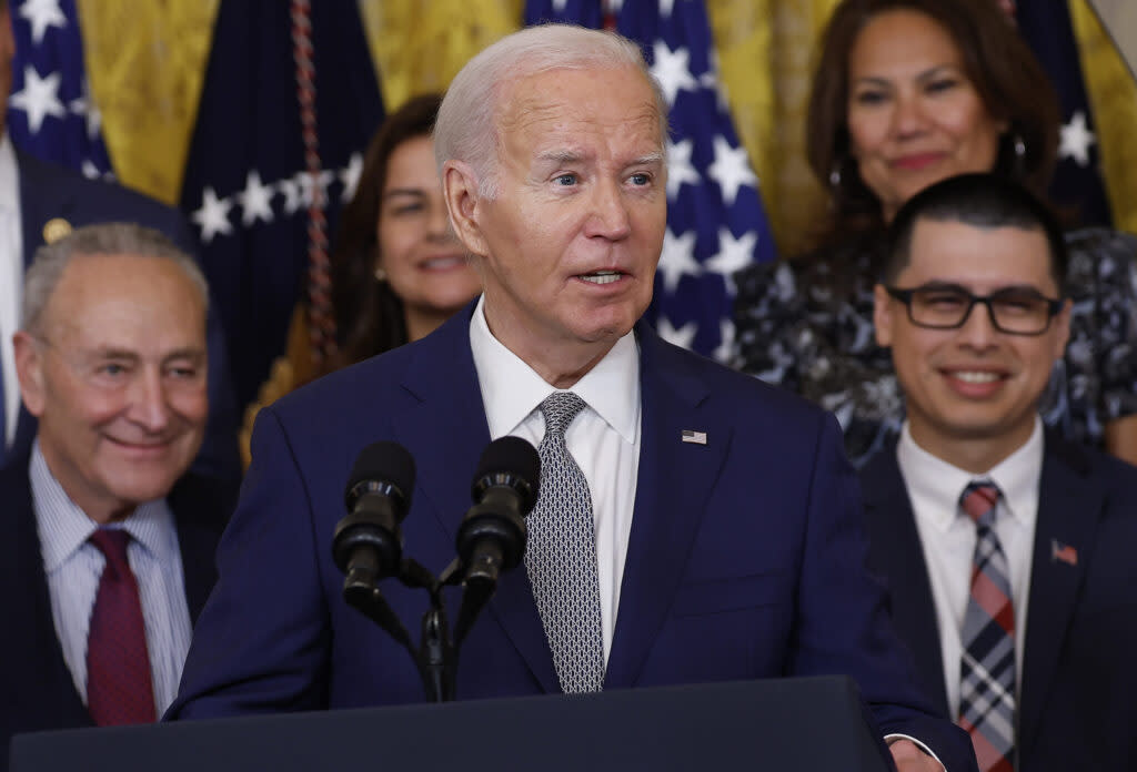 President Joe Biden speaks at an event marking the 12th anniversary of the Deferred Action for Childhood Arrivals program in the East Room at the White House on June 18, 2024, in Washington, D.C. At left is Senate Majority Leader Chuck Schumer, D-N.Y. (Photo by Kevin Dietsch/Getty Images)