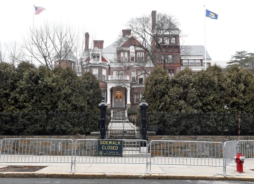 This Sunday Jan. 17, 2021, file photo shows the New York state Executive Mansion surrounded with security fencing in Albany, N.Y. (AP Photo/Hans Pennink, File)