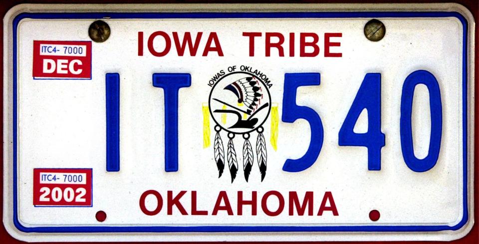 oklahoma tags page: iowa tribe plate, stillwater. shot on fri. 5 July 2002. Photo by robert s. cross