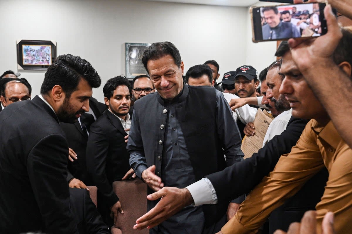 Pakistan’s former prime minister, Imran Khan arrives at a registrar office in Lahore High court to sign surety bonds for bail in various cases, in Lahore on 3 July (AFP via Getty)