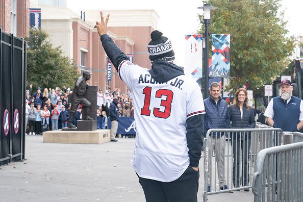 ATLANTA, GA - NOVEMBER 05: Fans cheer for Ronald Acuña Jr. of the Atlanta Braves as he gets on the buses before their World Series Parade at Truist Park on November 5, 2021 in Atlanta, Georgia. The Atlanta Braves won the World Series in six games against the Houston Astros winning their first championship since 1995. (Photo by Megan Varner/Getty Images)