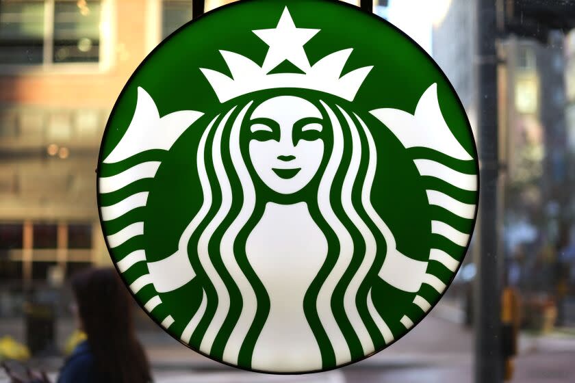 FILE - The Starbucks logo is displayed in the window of a downtown Pittsburgh Starbucks on Monday, Nov. 7, 2022. Workers at more than 100 U.S. Starbucks stores are scheduled to go on strike Thursday, Nov. 17, the same day the company plans its annual giveaway of reusable holiday cups. (AP Photo/Gene J. Puskar, File)