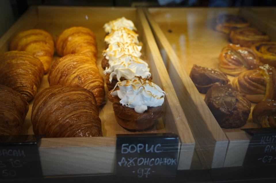 FILE - Puff pastry cakes, center, named after British Prime Minister Boris Johnson on sale in a city cafe in Kyiv, Ukraine, Wednesday, June 8, 2022. When British Prime Minister Boris Johnson survived a no-confidence vote this week, at least one other world leader shared his relief. Ukrainian President Volodymyr Zelenskyy said it was “great news” that “we have not lost a very important ally.” It was a welcome endorsement for a British leader who divides his country, and his party, but has won wide praise as an ally of Ukraine. (AP Photo/Efrem Lukatsky, File)