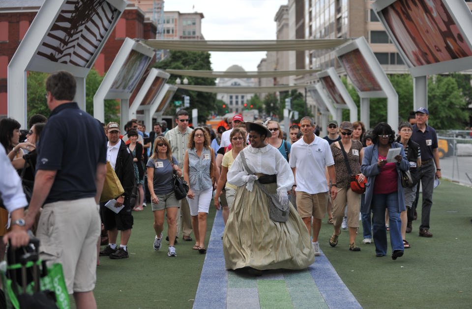 WASHINGTON, DC - MAY 22: Actress Danielle Drakes, a tour guide at Ford's Theatre, leads a DC walking tour dressed as Mary Todd Lincoln's seamstress Elizabeth Keckly on May 22, 2010, in Washington, DC.       (Photo by Jahi Chikwendiu/The Washington Post via Getty Images)