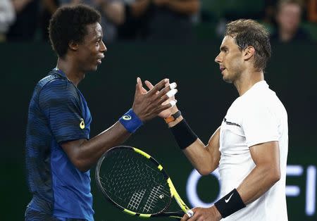 Tennis - Australian Open - Melbourne Park, Melbourne, Australia - 23/1/17 Spain's Rafael Nadal shakes hands after winning his Men's singles fourth round match against France's Gael Monfils. REUTERS/Thomas Peter