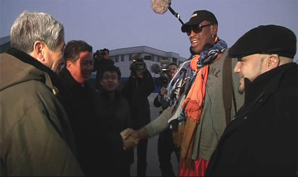 Retired U.S. basketball star Dennis Rodman (2nd R) shakes hands with officials upon arriving in North Korea, in this still image taken from video released by North Korea's Korean Central News Agency (KCNA) in Pyongyang December 19, 2013. Rodman said on Thursday he was not going to North Korea to talk about politics or human rights, despite political tension surrounding the execution of leader Kim Jong Un's uncle. Rodman has visited Pyongyang twice before, spending time dining as a guest of Kim, with whom he says he has a genuine friendship. (REUTERS/KCNA for Reuters TV)