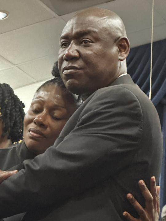 Attorney Ben Crump embracing Pamela Dias, the mother of the Florida neighbor shooting victim Ajike Owens, Wednesday, June 7, 2023, at a news conference in Ocala Fla. Susan Louise Lorincz, 58, who is accused of fatally shooting Owens last week in the violent culmination of what the sheriff described as a 2 and a half year feud was arrested Tuesday, June 6, the Marion County Sheriff’s Office said. (AP Photo/Curt Anderson)