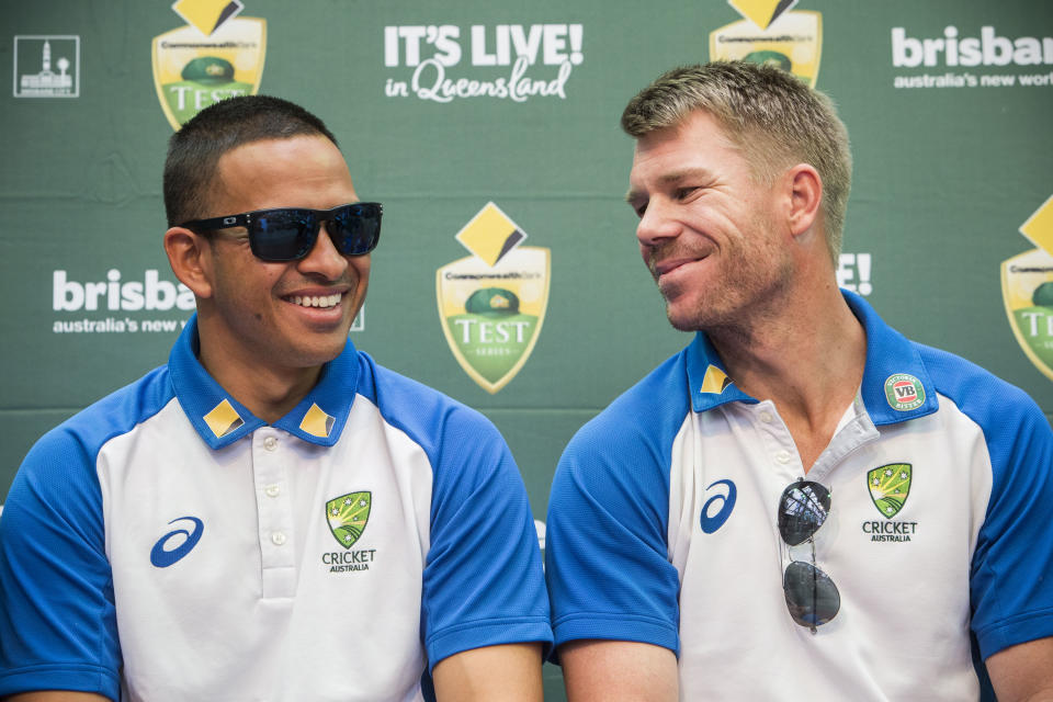 Usman Khawaja (pictured left) and David Warner (pictured right) share a laugh at a press conference.