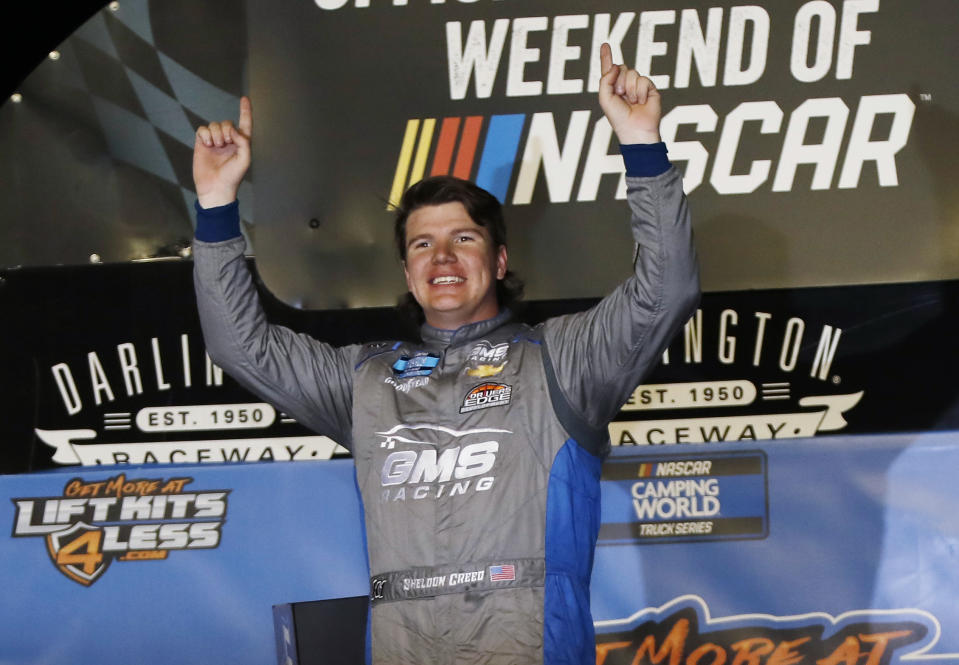 Sheldon Creed celebrates in Victory Lane after winning the NASCAR Truck Series auto race at Darlington Raceway, Friday, May 7, 2021, in Darlington, S.C. (AP Photo/Terry Renna)