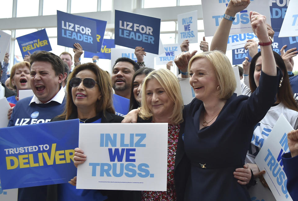 FILE - British Foreign Secretary Liz Truss meets supporters as she arrives to attend a Conservative leadership election hustings at the NEC, Birmingham, England, Tuesday, Aug. 23, 2022. Britain's new leader, Liz Truss, is the child of left-wing parents who grew up to be an admirer of Conservative Prime Minister Margaret Thatcher. Now she is taking the helm as prime minister herself, with a Thatcherite zeal to transform the U.K. One colleague who has known Truss since university says she is “a radical” who wants to “roll back the intervention of the state” in people’s lives, just as Thatcher once did. (AP Photo/Rui Vieira, File)