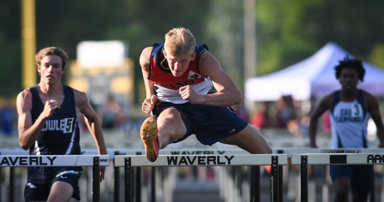 Mason junior Tyler Baker (4) outpaces Fowler's Brady Feldpausch and Darryle Geter, right, of East Lansing, Tuesday, May 30, 2023, clocking a 15.22 in first place in the 110 meter hurdles during the Greater Lansing Honor Roll Meet at Waverly.