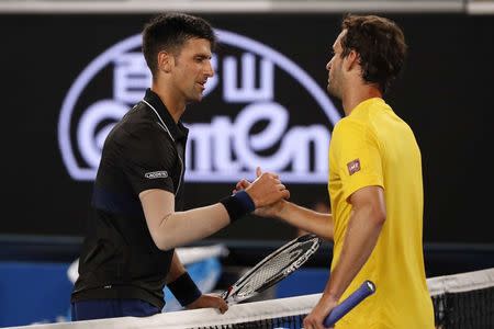 Tennis - Australian Open - Margaret Court Arena, Melbourne, Australia, January 20, 2018. Serbia's Novak Djokovic shakes hands with Spain's Albert Ramos-Vinolas after Djokovic won their match. REUTERS/Issei Kato