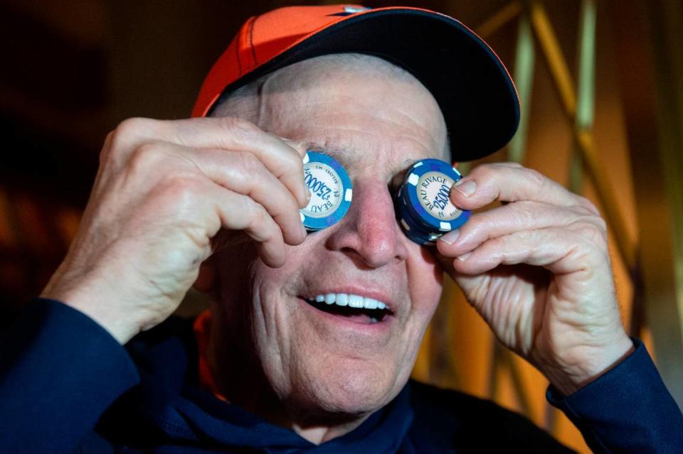 Jim McIngvale, better known as ‘Mattress Mack’, holds up $25,000 chips over his eyes before placing a $500,000 bet on the Houston Cougars Men’s Basketball team to win the NCAA Tournament at the Beau Rivage in Biloxi on Tuesday, Nov. 15, 2022.