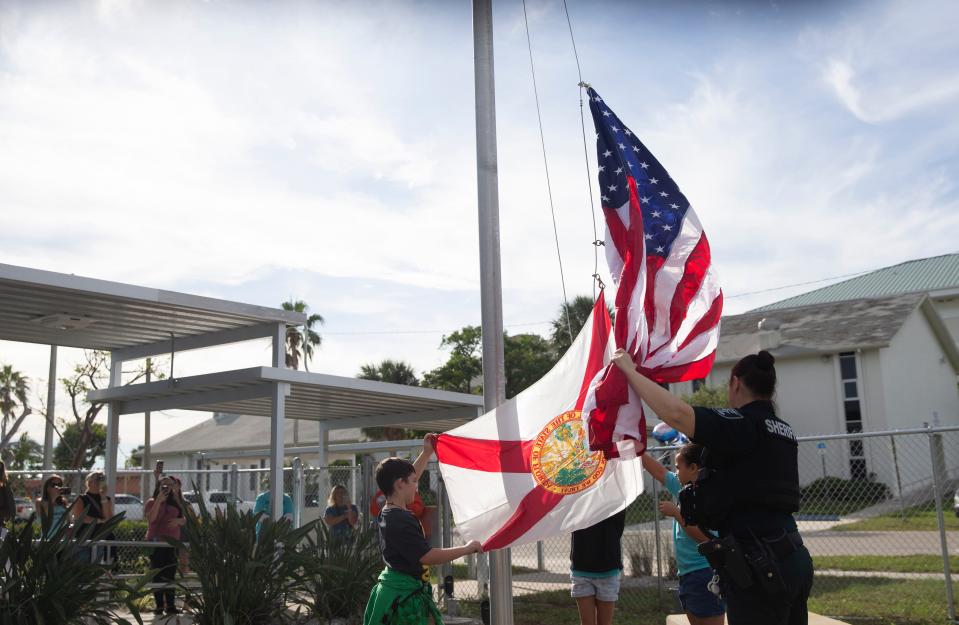 A flag donated by the Daughters of the American Revolution, Estero Island Chapter is raised at Fort Myers Beach Elementary on Tuesday, Dec. 5, 2023. The school reopened after more than a year of being closed. The school sustained significant damage in Hurricane Ian last year. The historic part of the school was renovated. Adjoining buildings and classrooms were demoed. The school houses kindergarten through fifth grade. The American flag flew over the U.S. Capitol on Sept. 28, 2023. The Florida flag flew over the Florida capitol building on Sept. 28, 2023.