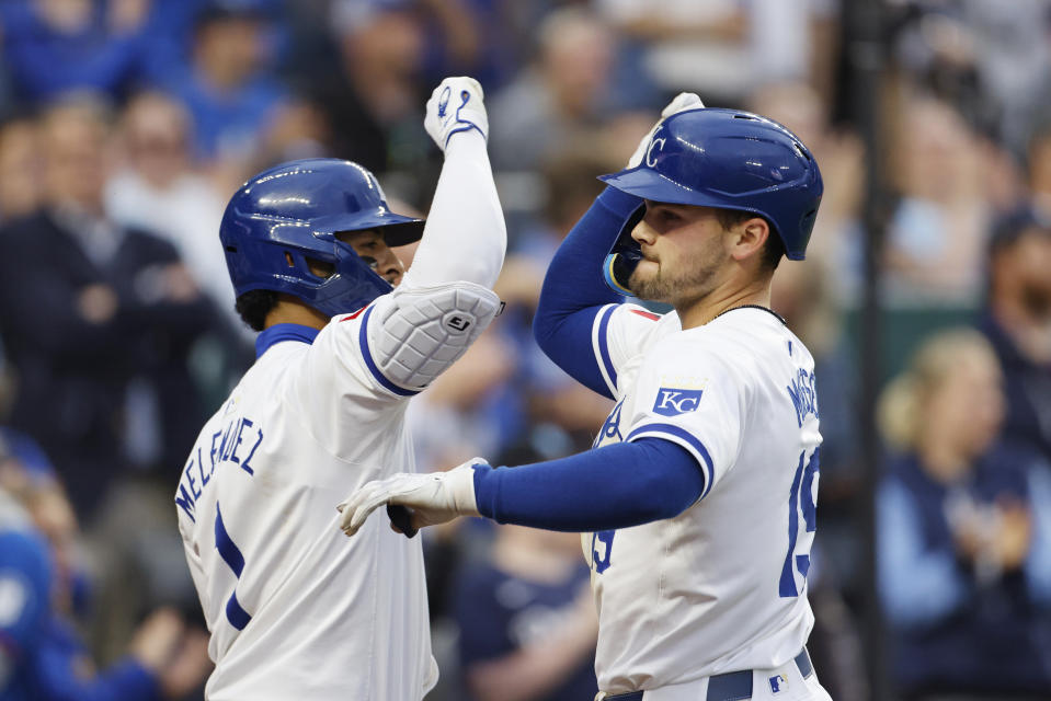 Kansas City Royals' Michael Massey (19) celebrates with MJ Melendez (1) after crossing home plate after hitting a solo home run during the seventh inning of a baseball game against the Milwaukee Brewers in Kansas City, Mo., Monday, May 6, 2024. (AP Photo/Colin E. Braley)