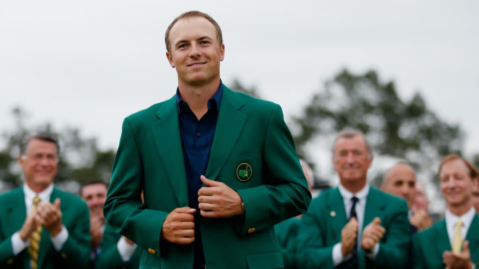 Spieth settles into his green jacket after victory in 2015. - Ezra Shaw/Getty Images