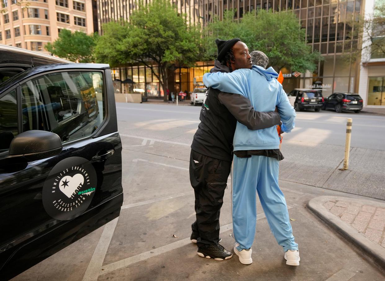 L.D. Davis, left, of the Homeless Engagement Assistance Response Team, hugs Don Franklin, who is experiencing homelessness, in downtown Austin last month. HEART members conduct homeless outreach and respond to nonemergency calls, building trust among those who are unsheltered.